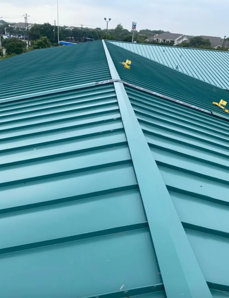Green commercial metal roof ridge and valley for Metal Roof Repair in Laurel Hill