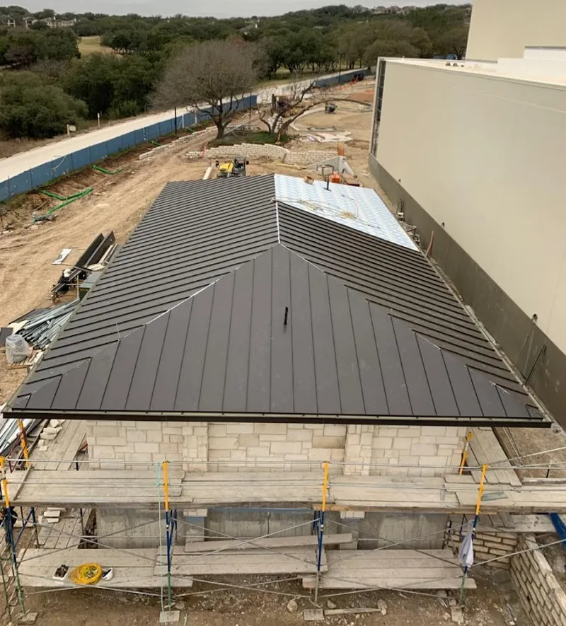 Metal roof new construction with scaffolding in Laurel Hill